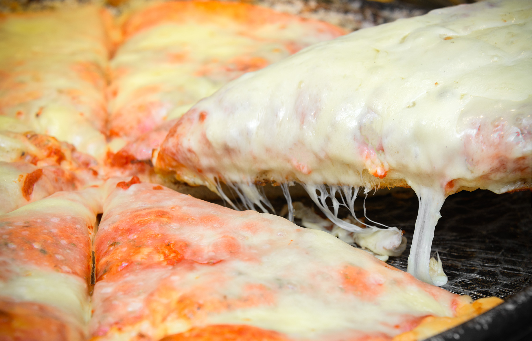 Trancio di DoppiaPizza con mozzarella filante
